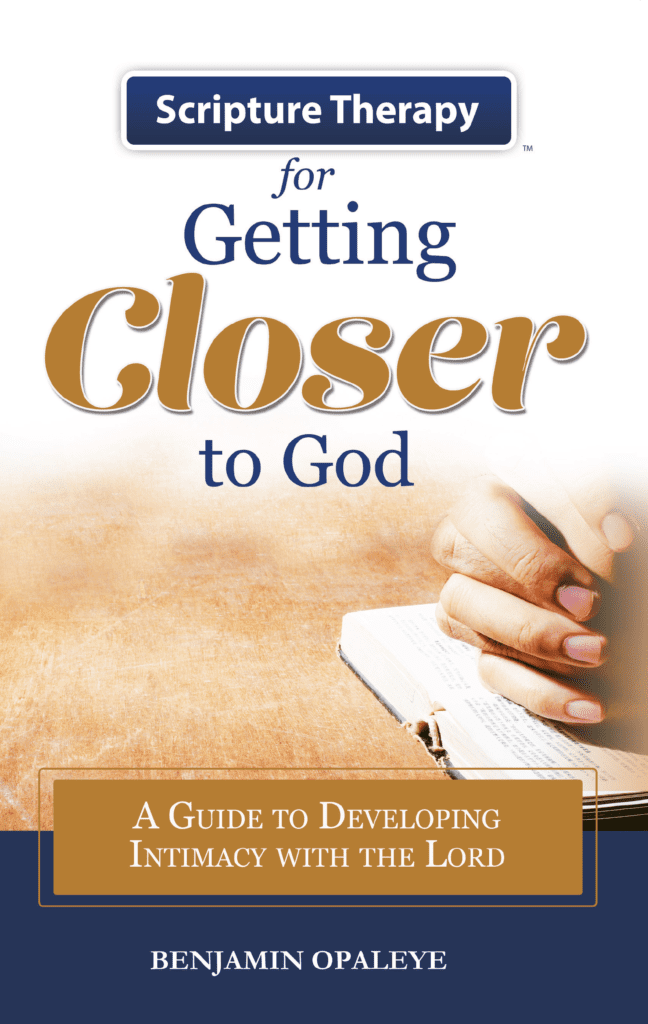 A book cover with someone holding their hands over an open bible.